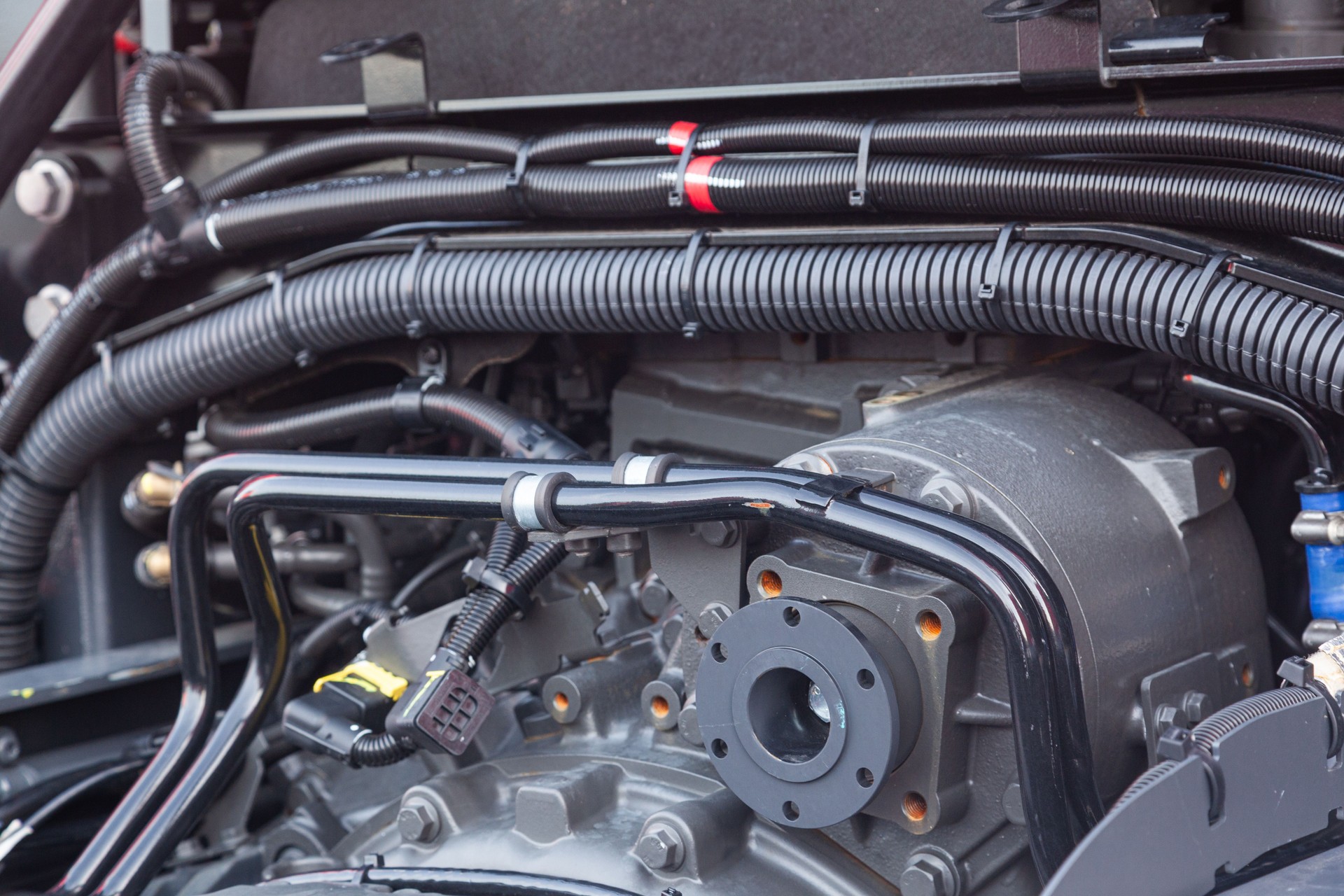 Electrical wiring and hydraulics of a truck.